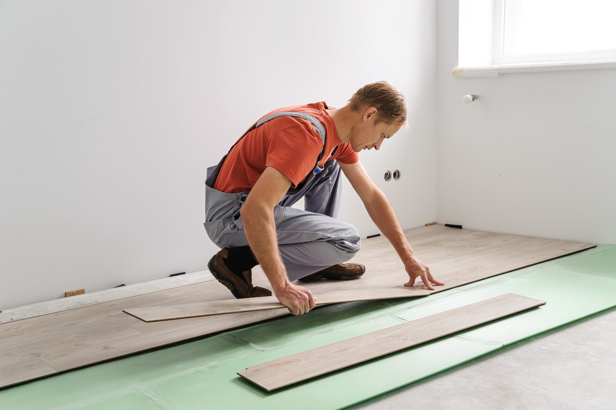 Installing laminate flooring.